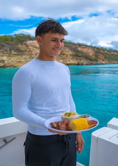 Guest relaxing aboard a private luxury yacht in Curaçao